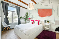 The background is a soft, light color.

