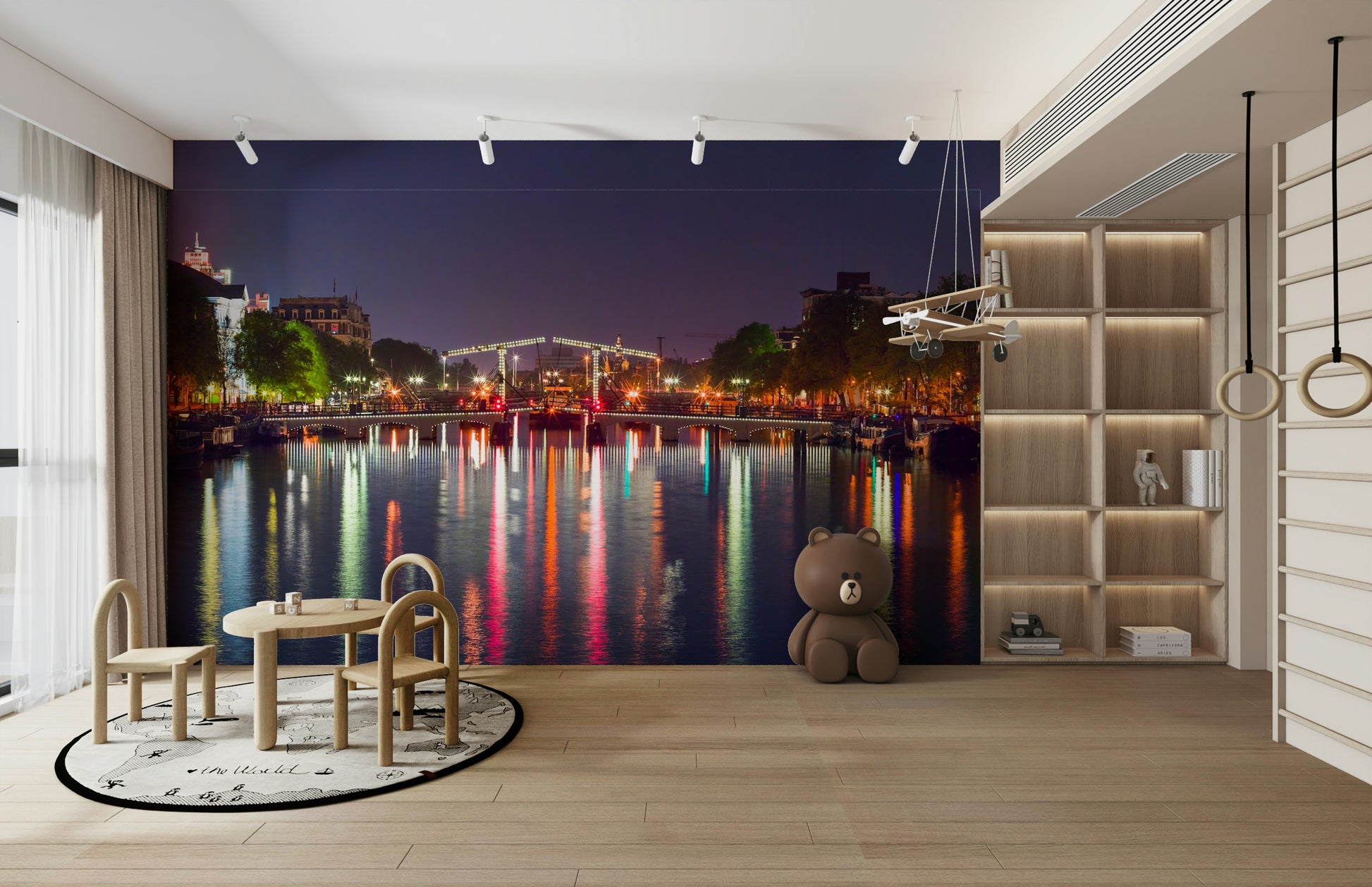 The water in the canal is calm and reflects the lights.

