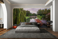 A long, flat-bottomed boat is visible on the water.

