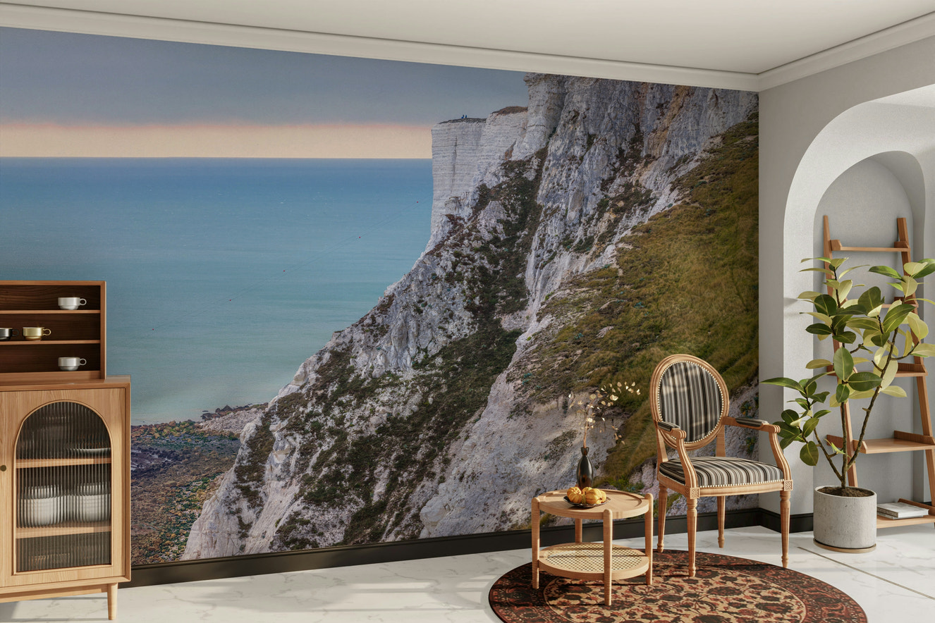 A peaceful wall mural with a view of a coastline.

