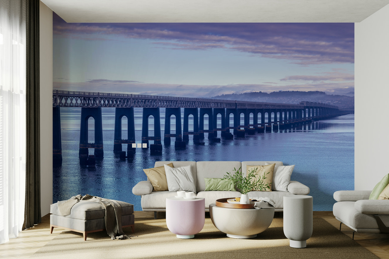 A peaceful wall mural with a panoramic view of a coastline.


