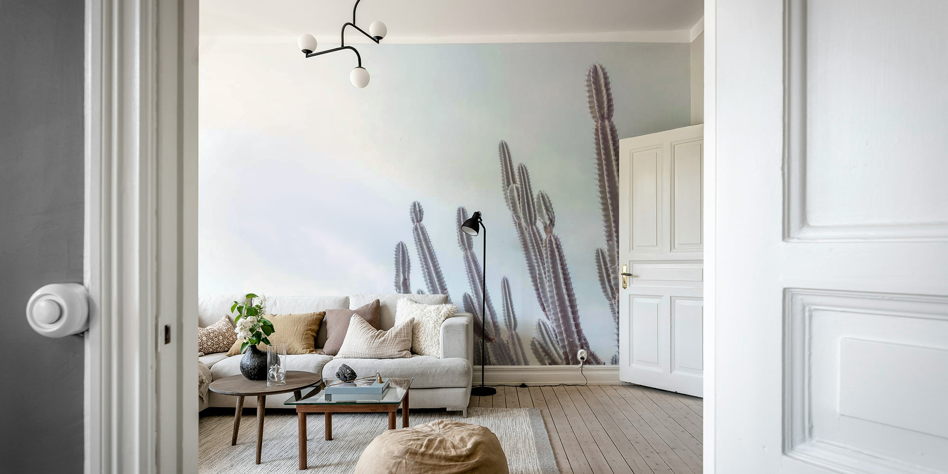 A peaceful wall mural with a desert scene.

