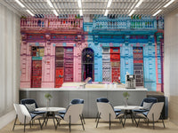 The main focus is a classic, colorful vintage car.

