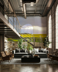 The sun is setting, casting a warm, golden glow on the fields.

