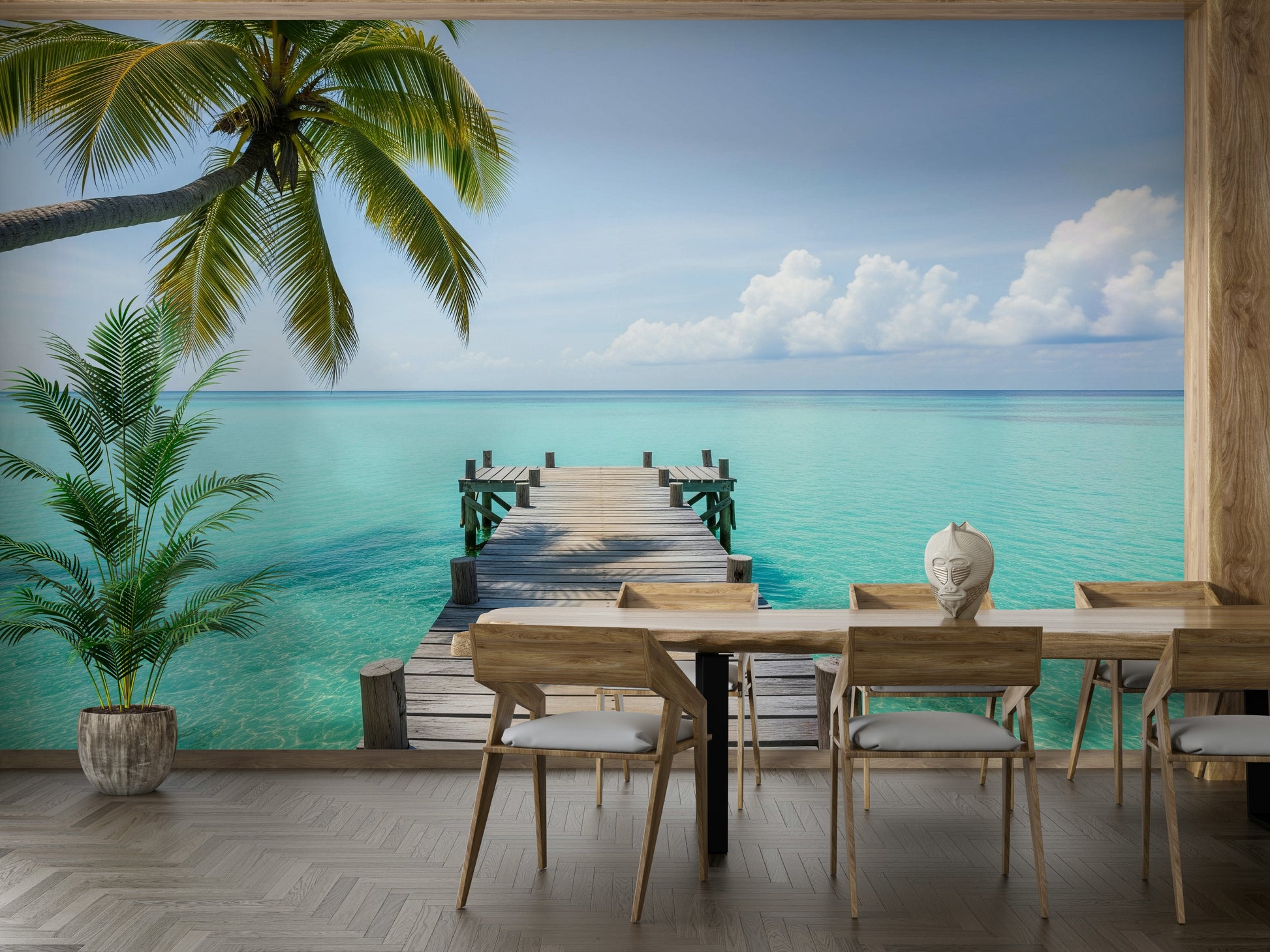 Close-up of a pier extending over calm tropical water

