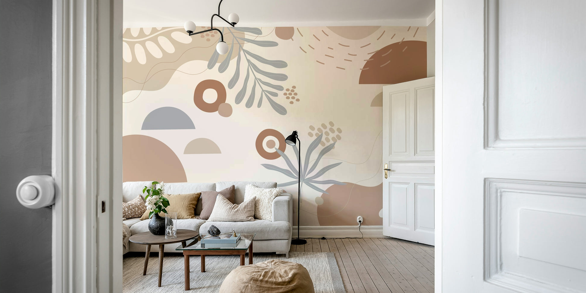 An abstract wall mural featuring a pattern of stylized leaves.

