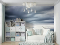 The design features a graceful ship sailing on a vast ocean.

