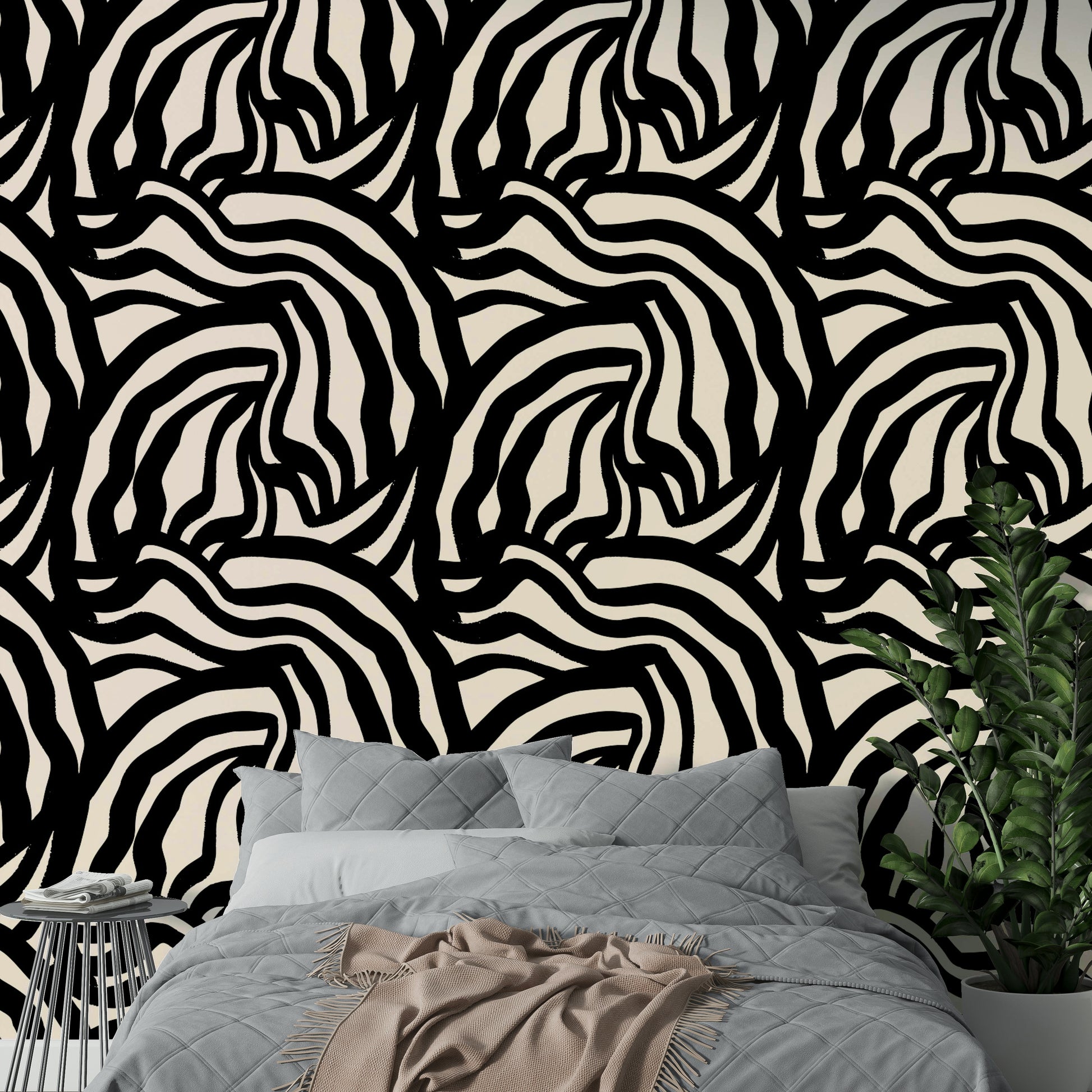 A bedroom wall featuring the wavy black lines mural, giving a calm and artistic feel