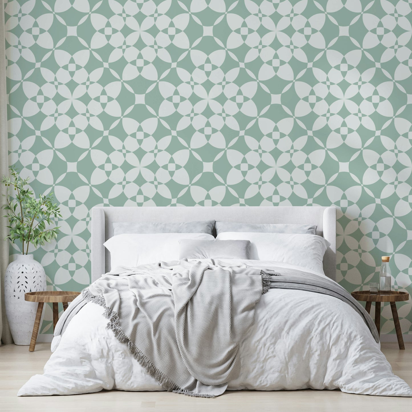 The soft, uniform tones of the wallpaper design.

