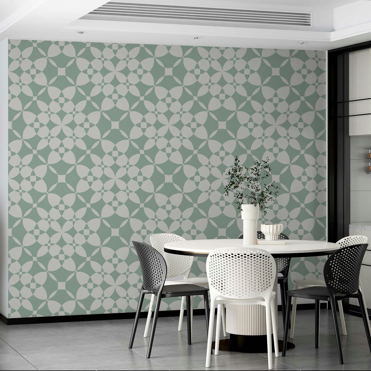An installation view of the wallpaper being hung on a wall.

