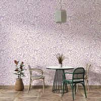 The soft, muted tones of the wallpaper design.

