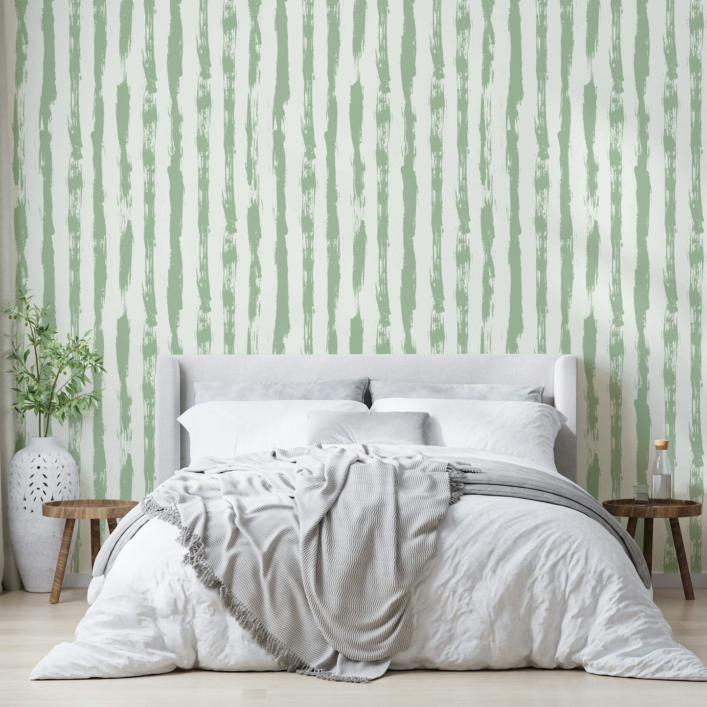 Wallpaper with a gentle sage green and white stripe design

