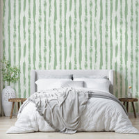 Wallpaper with a gentle sage green and white stripe design


