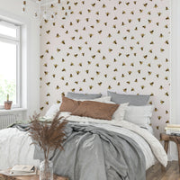 A child's room with a simple bee design

