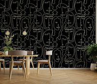 A contemporary bedroom with an abstract faces mural

