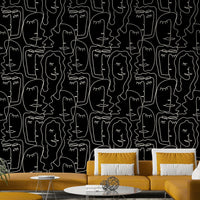 A modern studio decorated with a faces wallpaper

