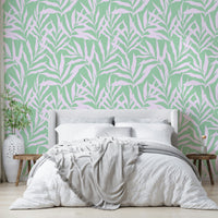 The image features large, stylized palm leaves with a wavy, fluid motion.
