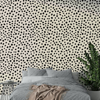 A modern office decorated with a black spots mural

