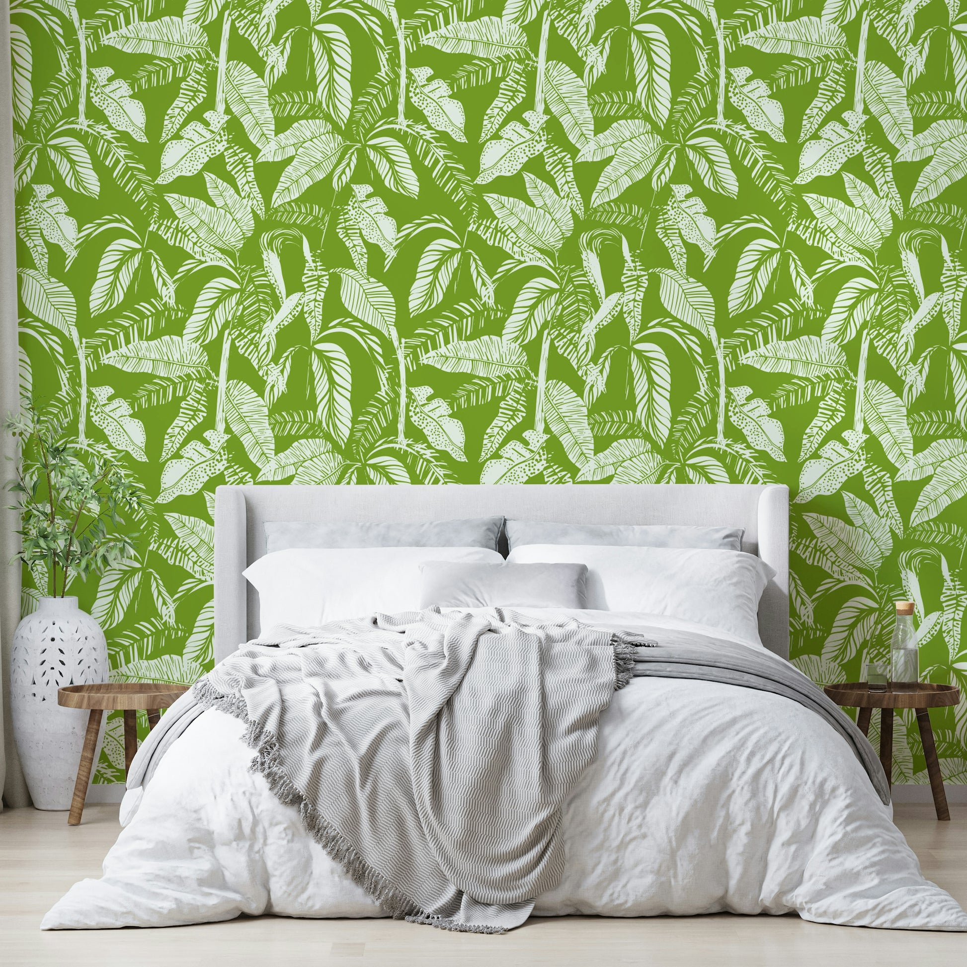 Green tropics wallpaper on a living room wall

