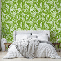 Green tropics wallpaper on a living room wall

