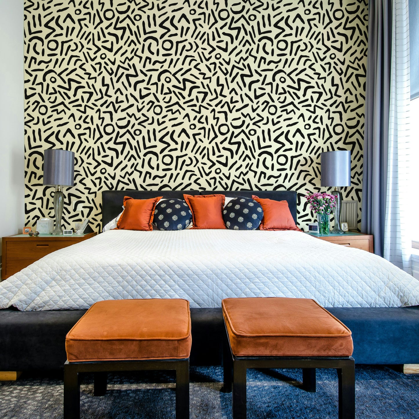 A bedroom with a unique tribal design

