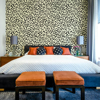 A bedroom with a unique tribal design

