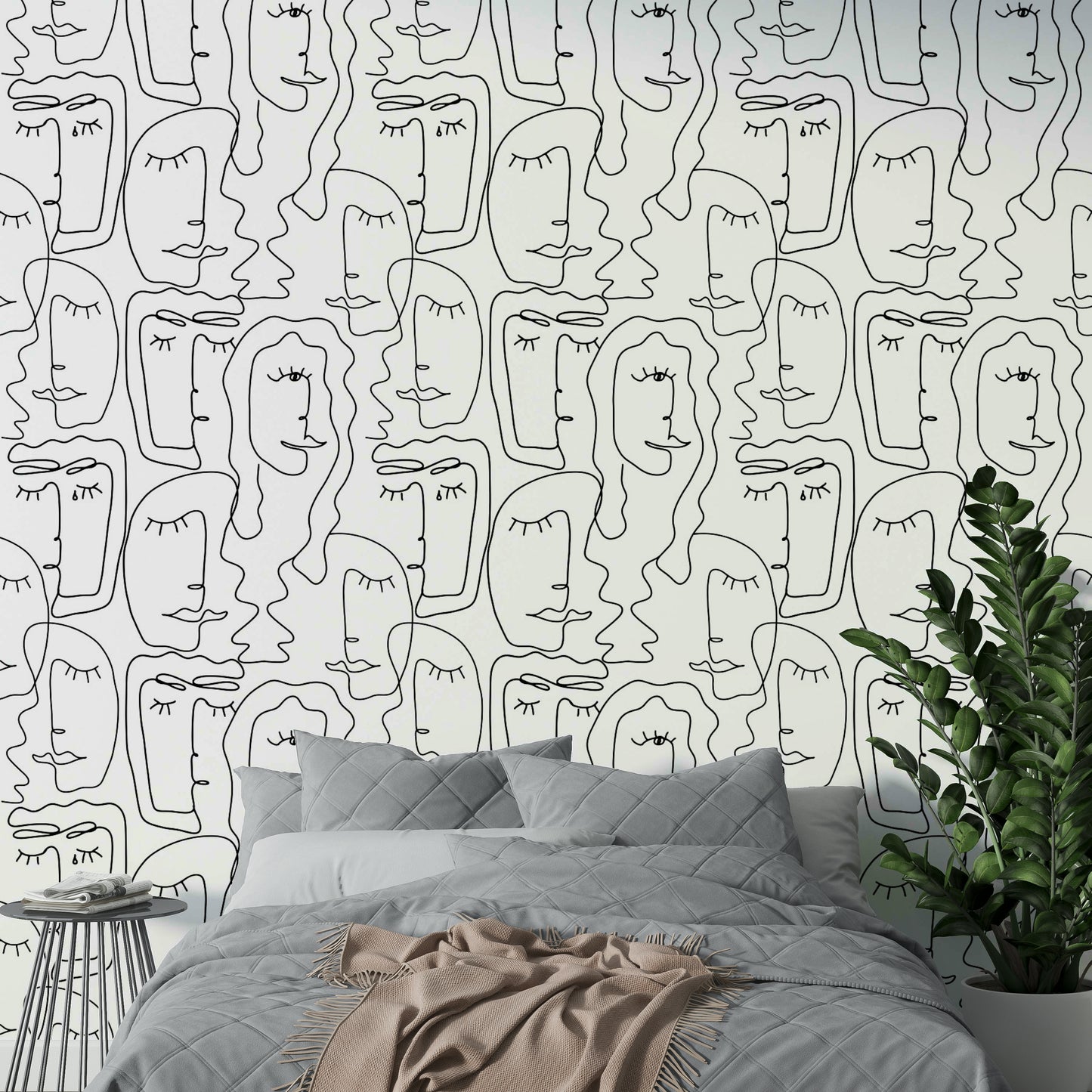 An angled shot of a wall with an artistic face wallpaper

