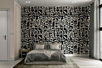 A bedroom with a unique, minimalist wall design

