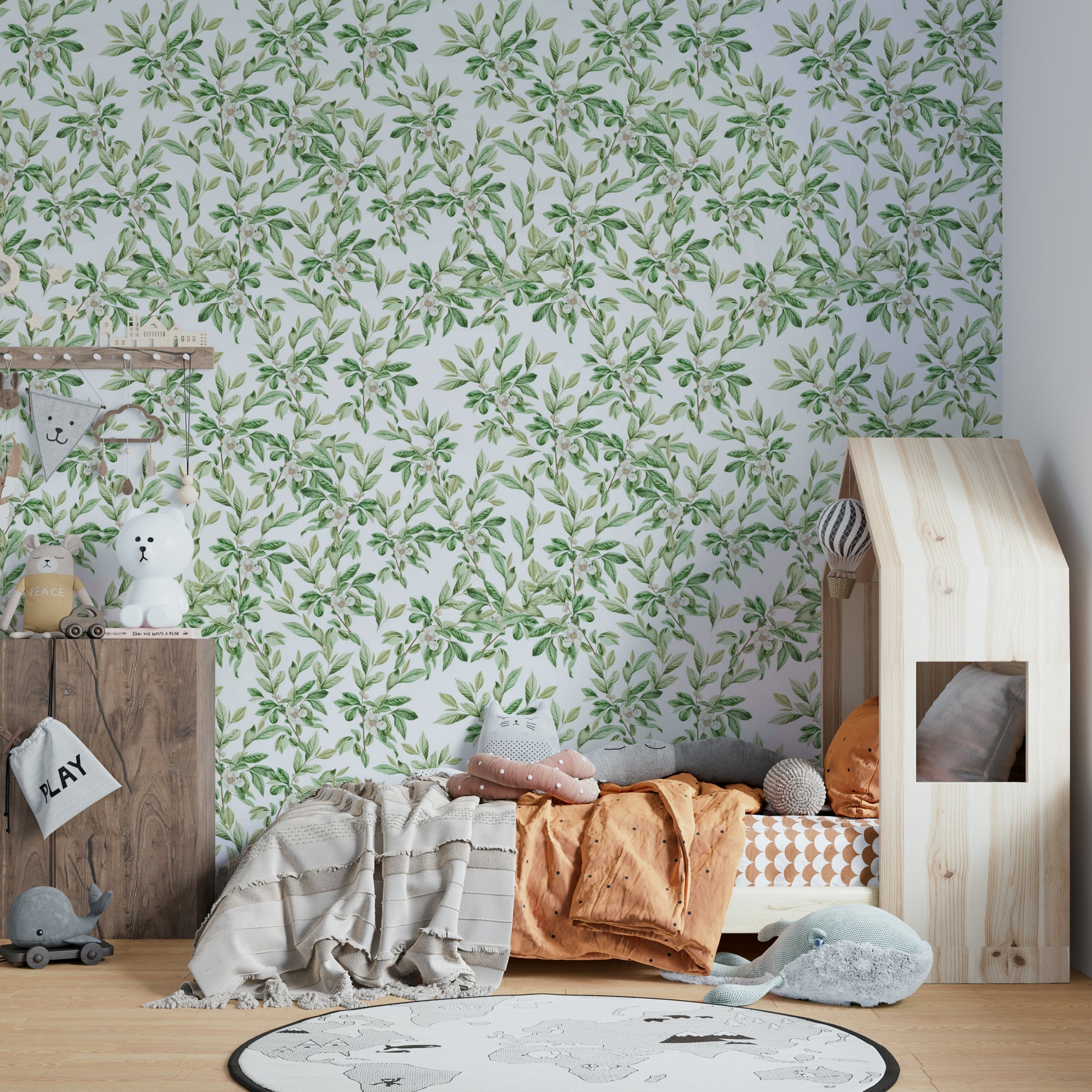 A full-wall mural showing a pattern of spring leaves.
