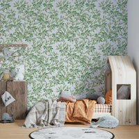 A full-wall mural showing a pattern of spring leaves.

