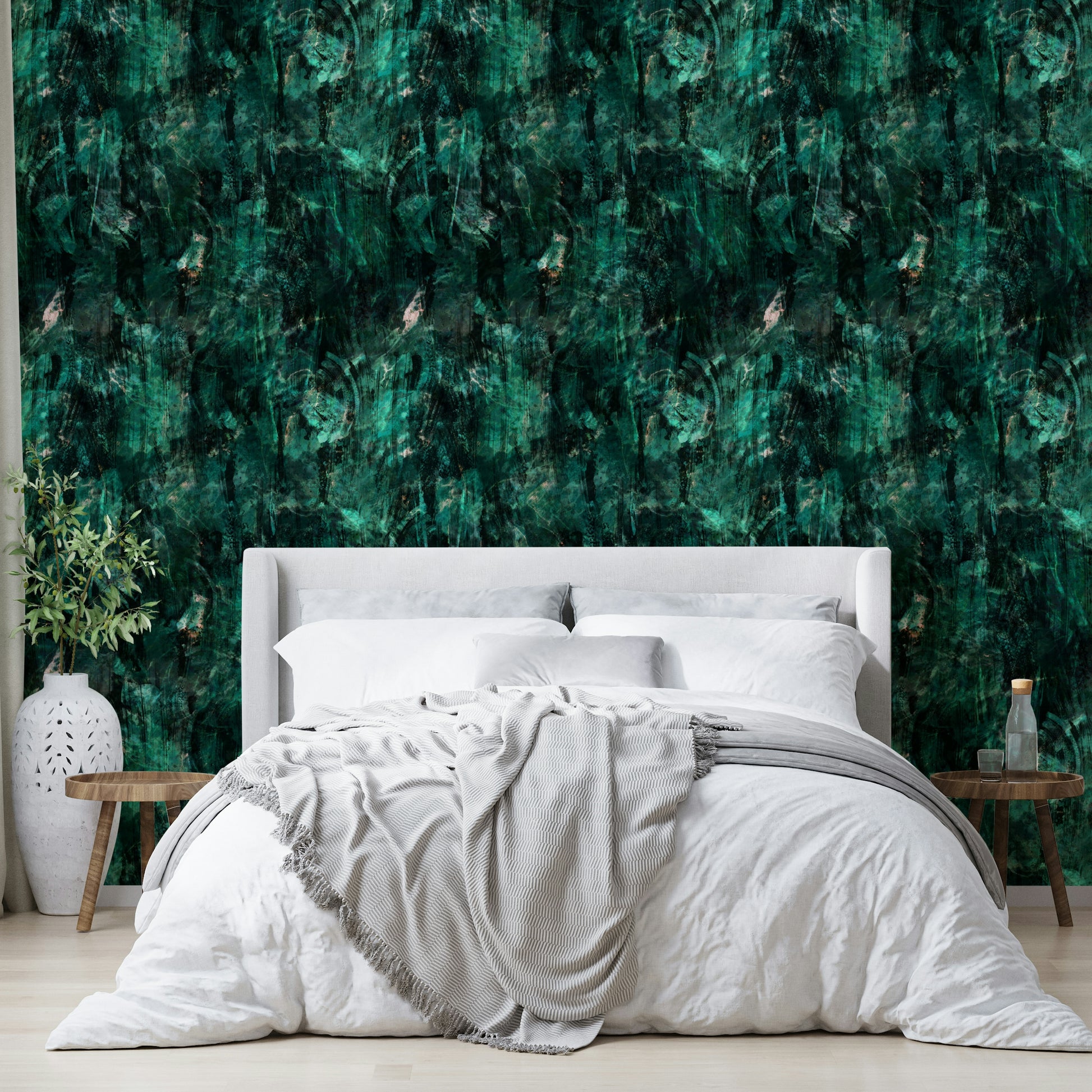 A bedroom with the minimalist mural behind the headboard.

