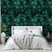 A bedroom with the minimalist mural behind the headboard.

