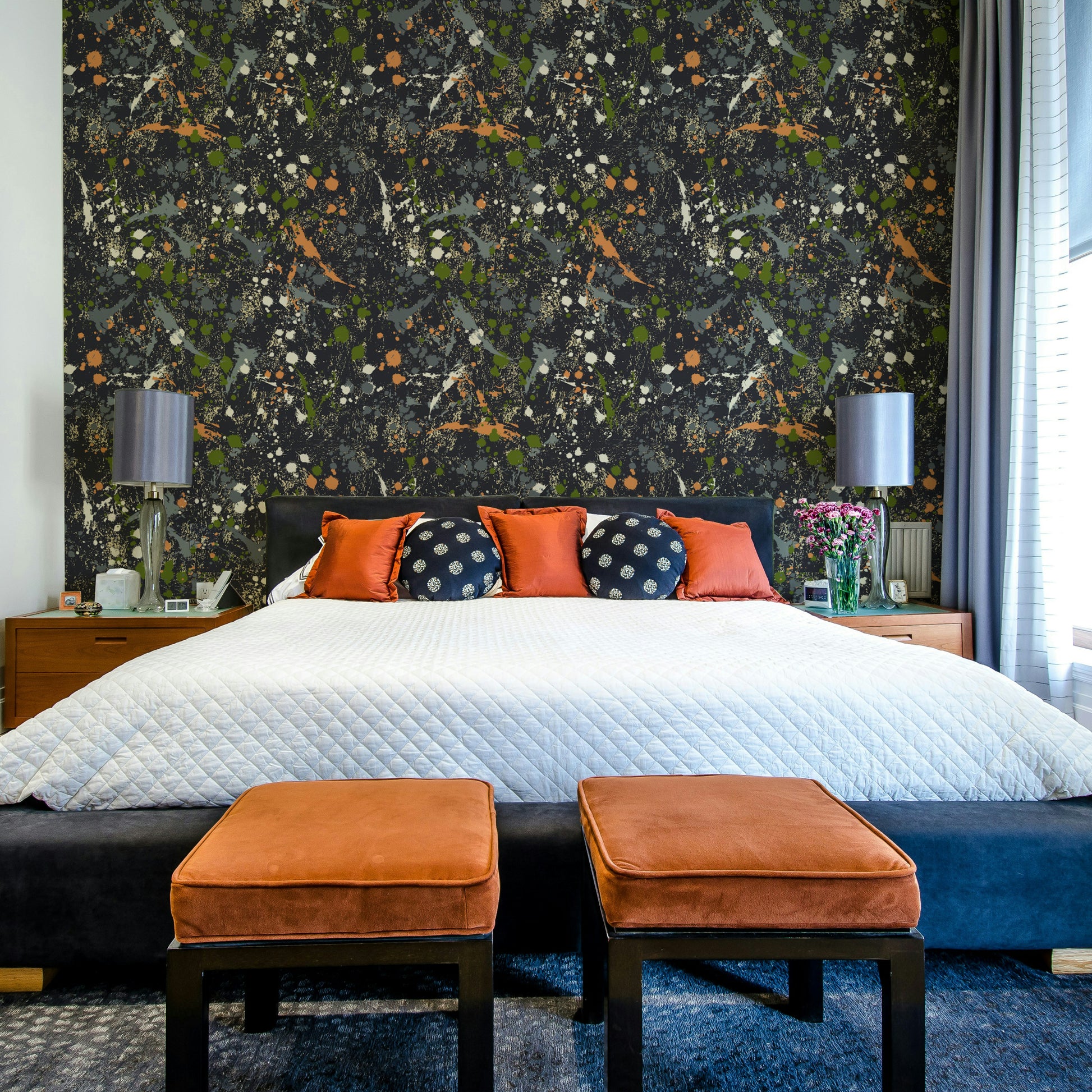 A beautiful modern living room with an ink splatter mural.

