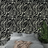The peel and stick wallpaper on a smooth wall surface.


