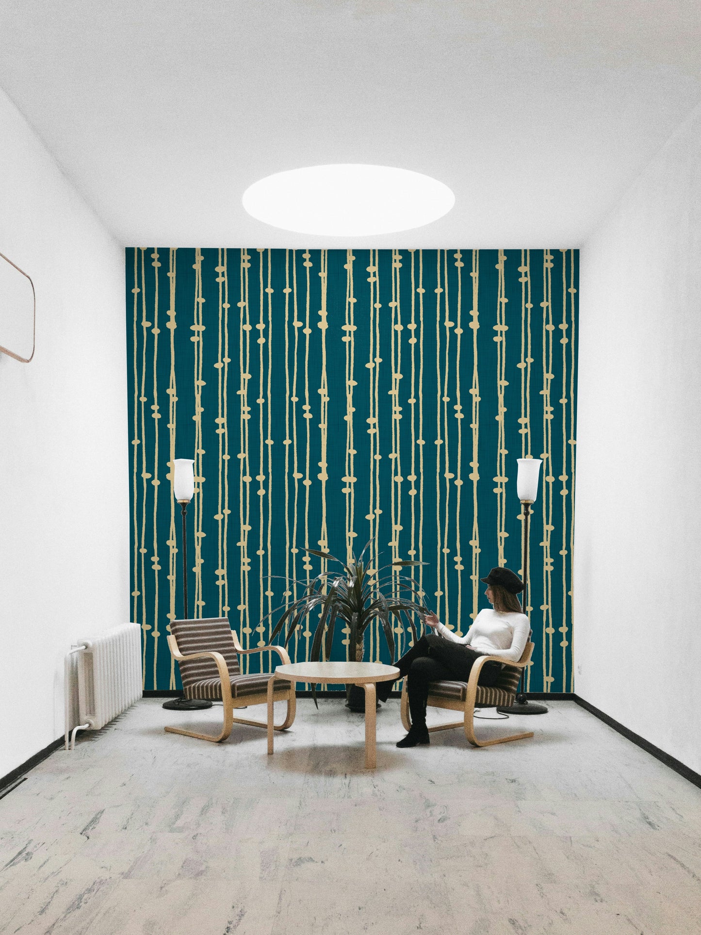 A contemporary living room with a boho striped wall mural.

