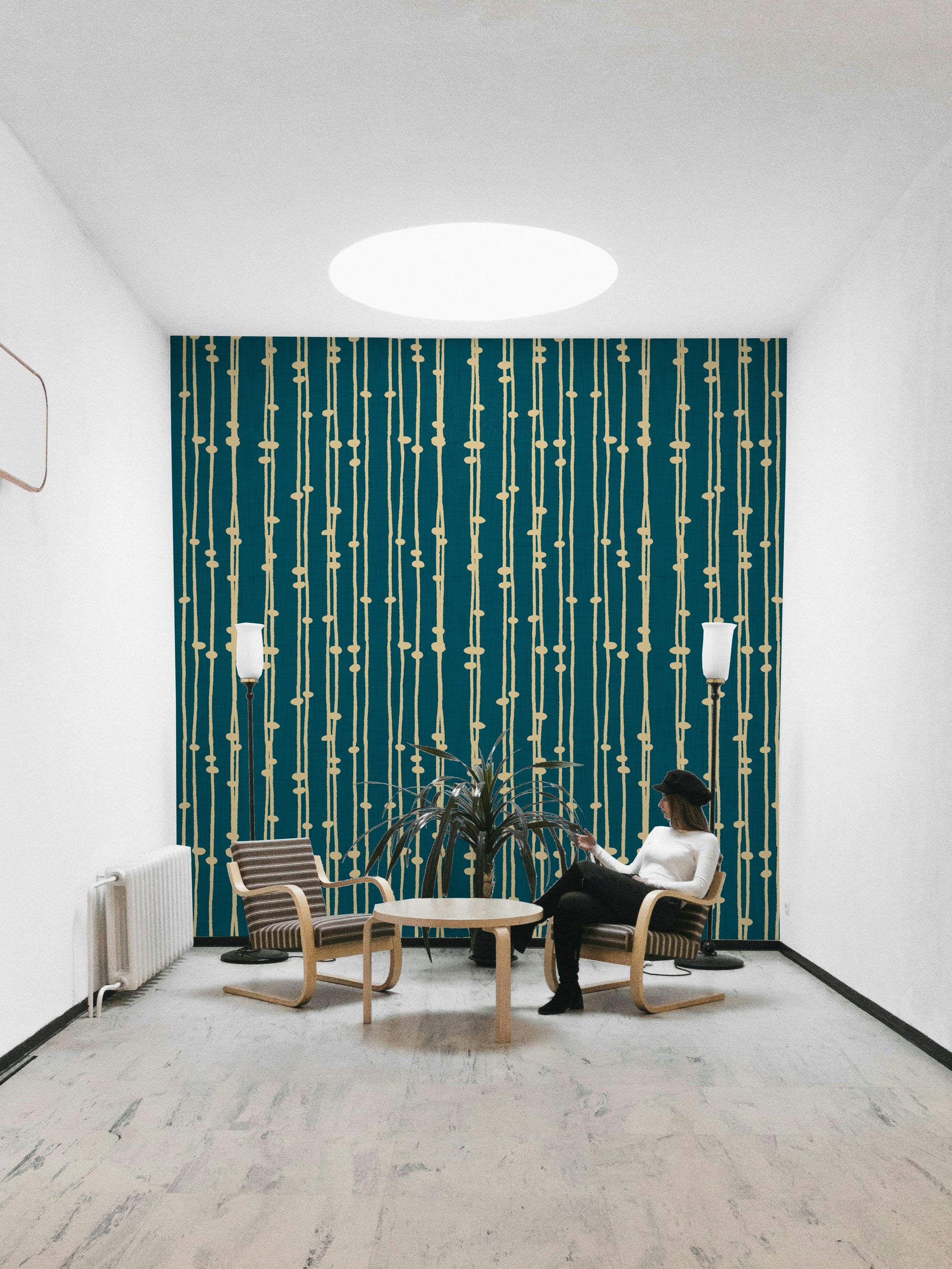 A contemporary living room with a boho striped wall mural.

