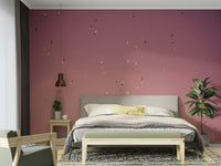 A bedroom with the sky mural behind the headboard.