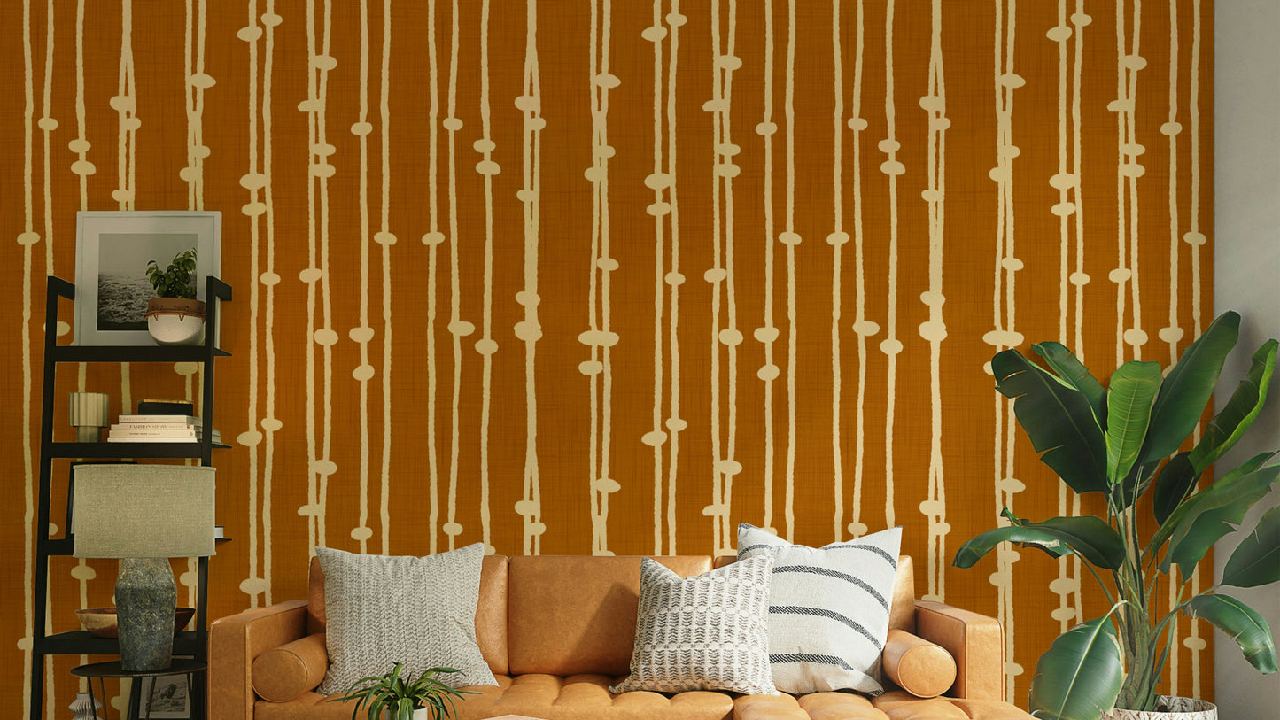 A contemporary living room with a boho striped wall mural.