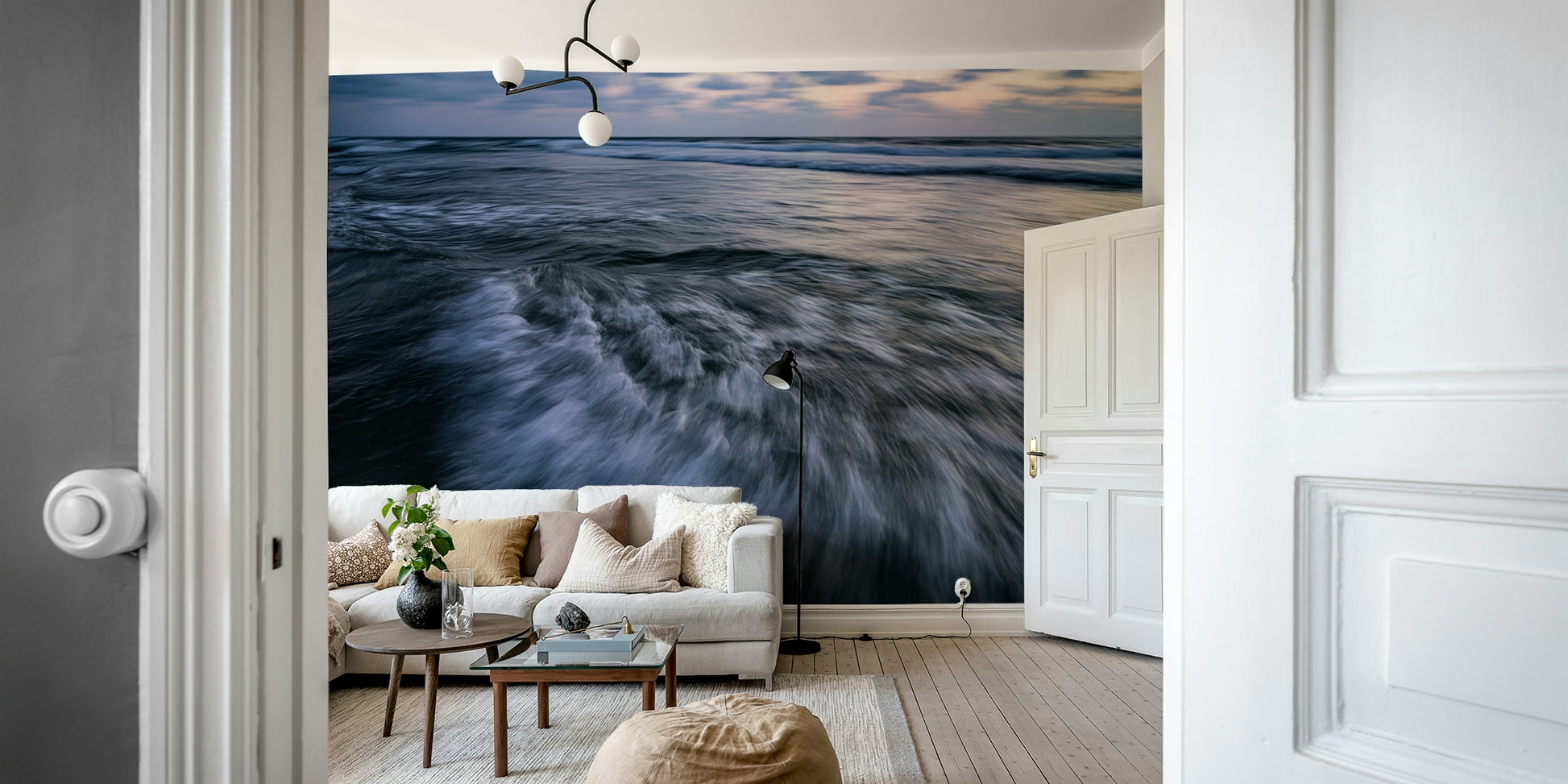 A minimalist home office with the abstract wave wallpaper.