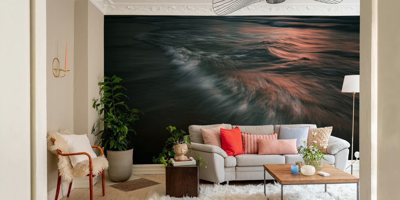 A contemporary living room with a large ocean wave wall mural.