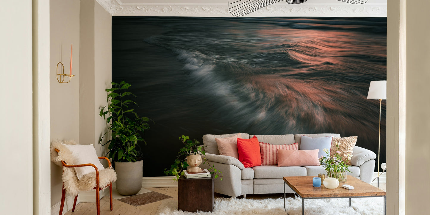 A contemporary living room with a large ocean wave wall mural.