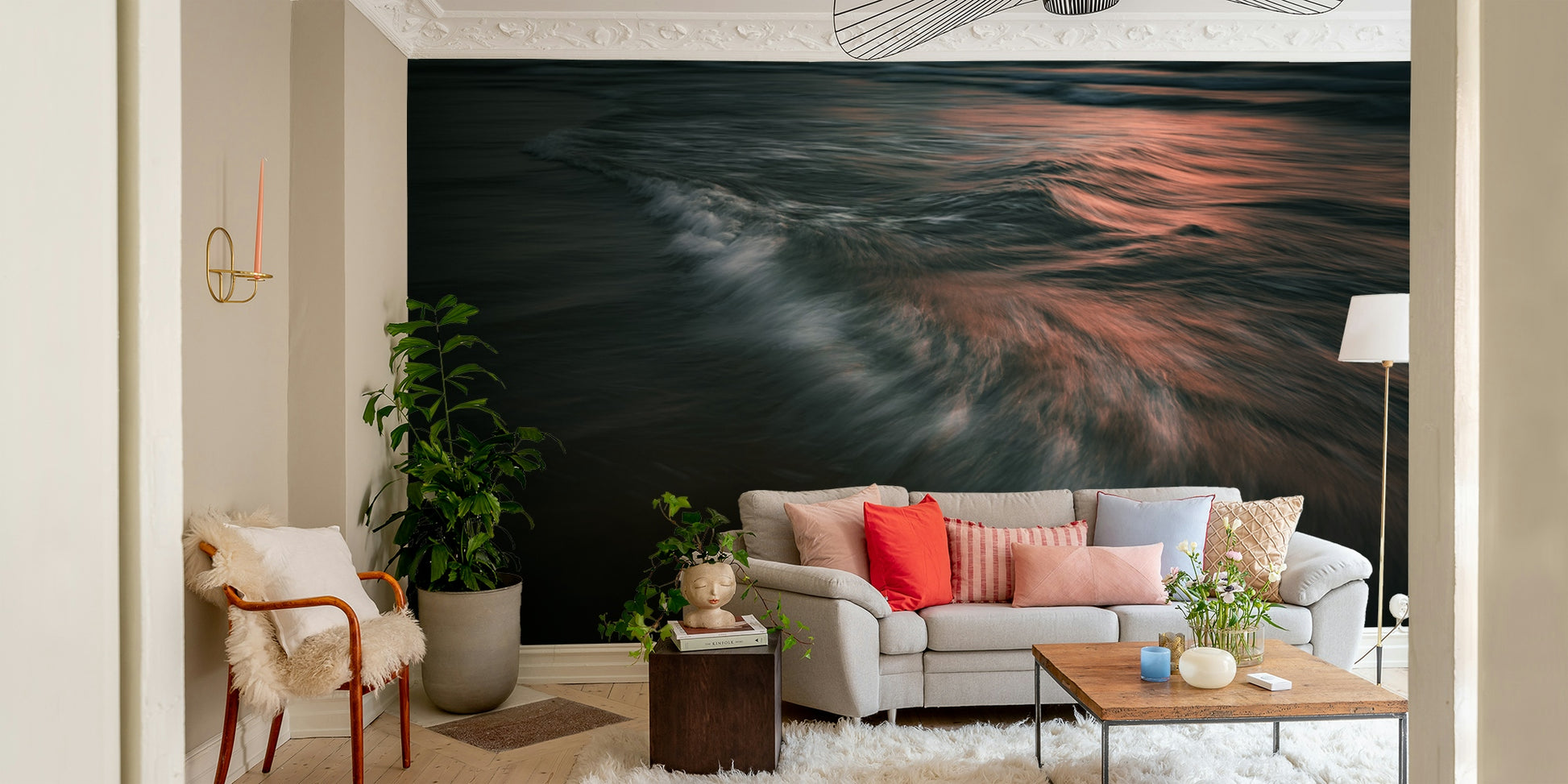 A contemporary living room with a large ocean wave wall mural.