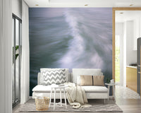 A minimalist home office with the abstract wave wallpaper.