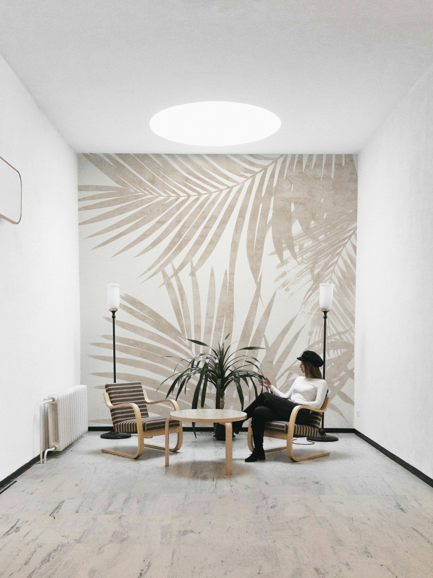 A fashion-forward jungle mural on decorative wallpaper.

