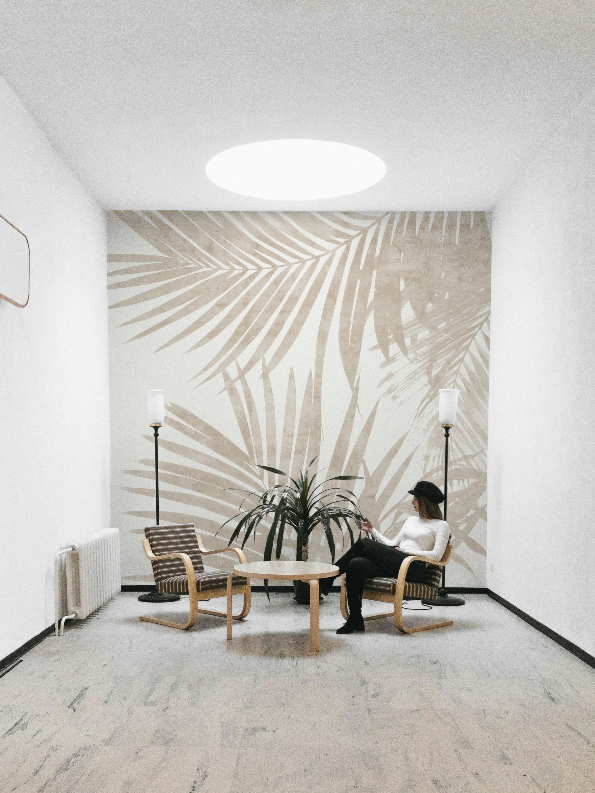 A fashion-forward jungle mural on decorative wallpaper.

