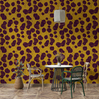 A bohemian plum leaf mural on decorative wallpaper.

