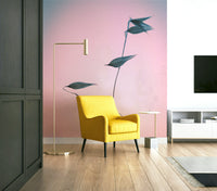 A contemplative nature wall mural in soft pink tones.

