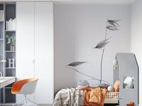 A beautiful, close-up, black and white photo of a plant stalk against a bright background.

