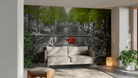 A living room featuring the iconic Amsterdam wall mural.

