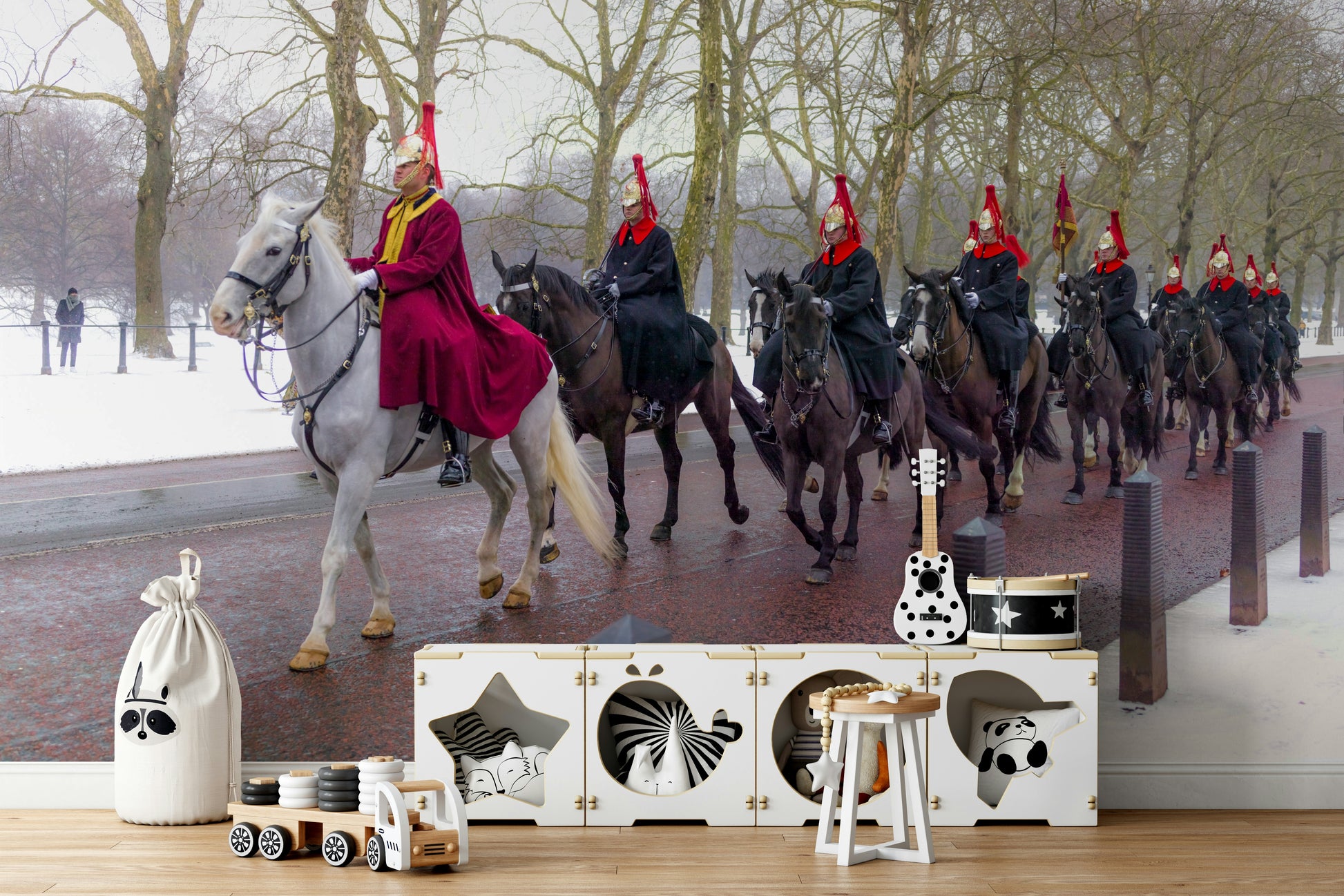A bedroom with the London mural behind the headboard.

